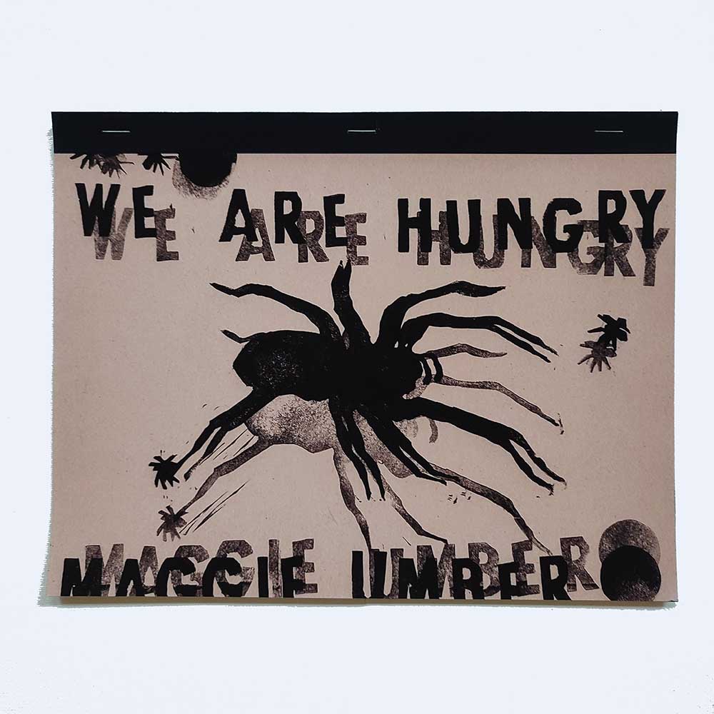 A print of a large, black silhouetted spider and a smaller one, shadowed, on a pale orange background with the words in black above WE ARE HUNGRY and below MAGGIE UMBER.