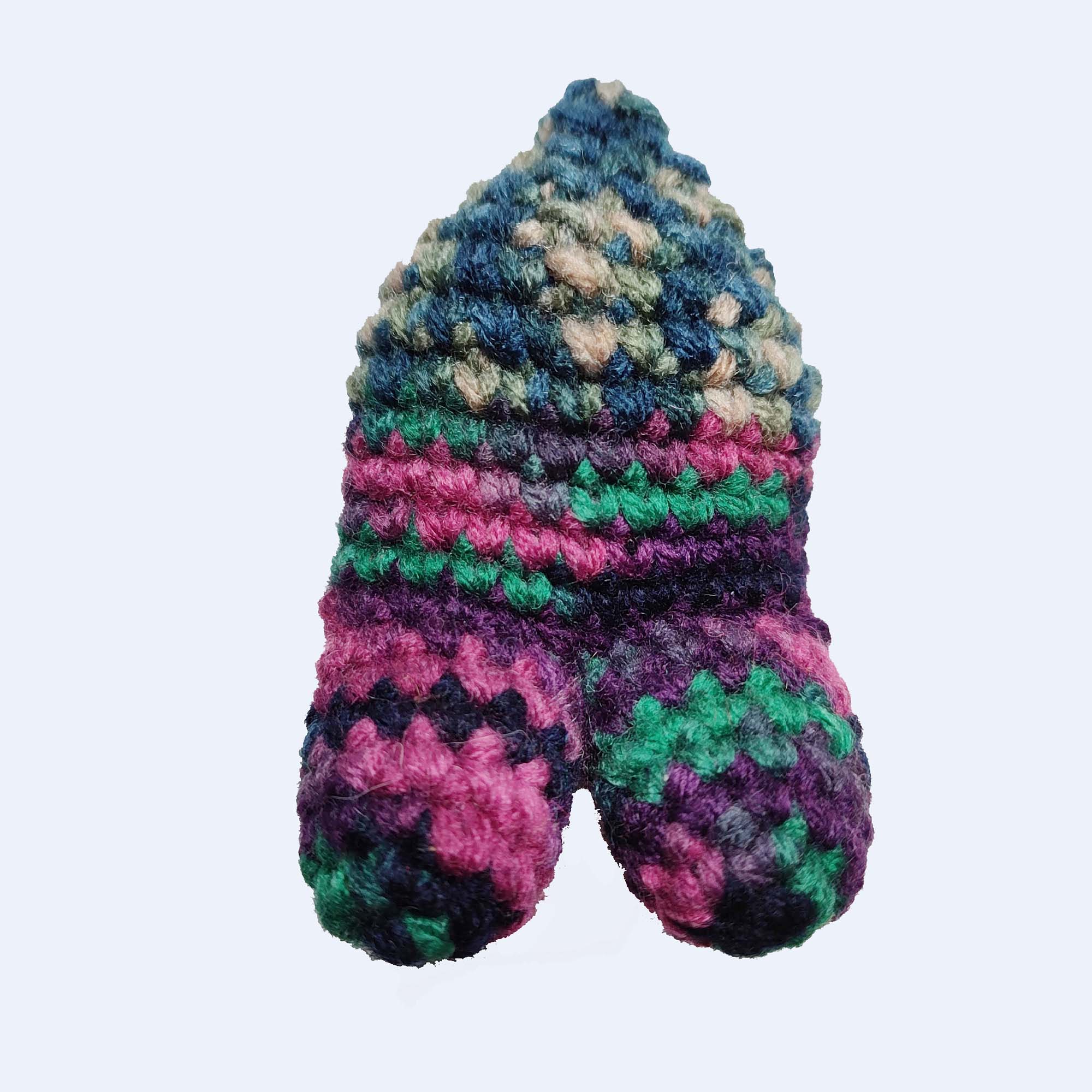 green, blue, pink crocheted nunion toy with four legs