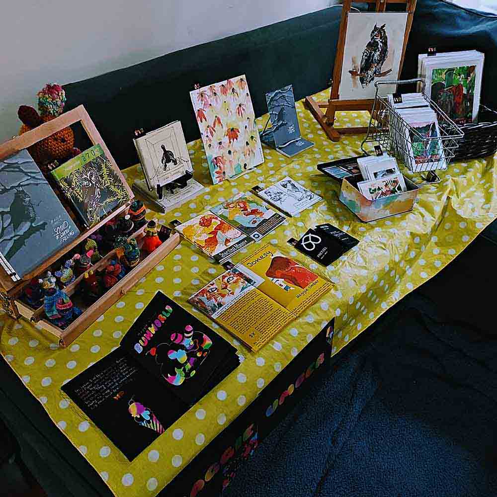 chicago zine fest table set up with zines, prints and toys by Maggie Umber