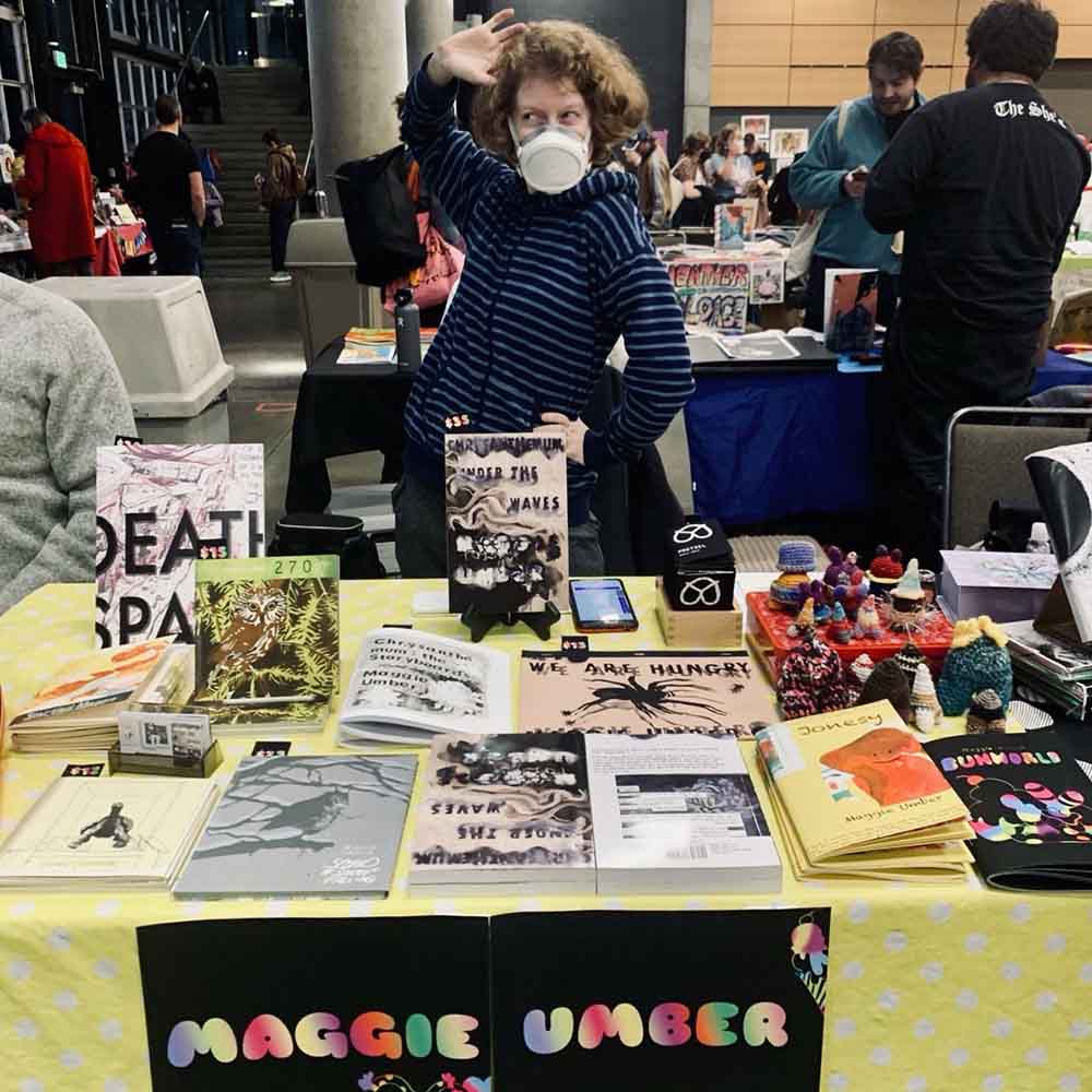 Maggie Umber at her table at the Short Run Comix Festival in Seattle, WA