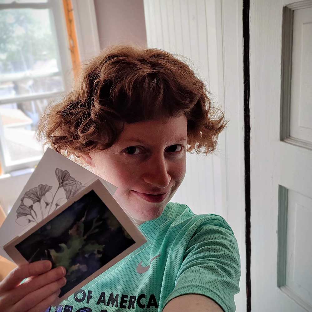 copyright Maggie Umber Maggie Umber holding prints for The Urban Birding Festival